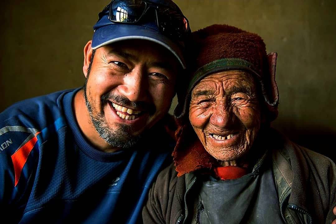 Tour Guide Abdul Rashid with Ladakhi villagers in a remote Himalayan village